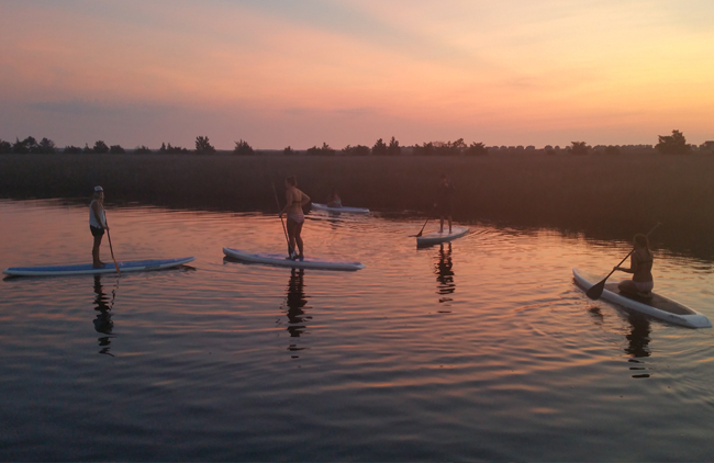 kayakers at sunset, courtesy Outer Banks Adventures