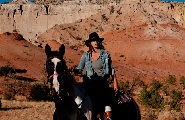 Guests at the Ghost Ranch can enjoy horseback riding, by Jamie Clifford